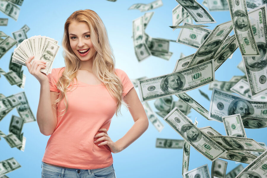Woman holding lots of cash